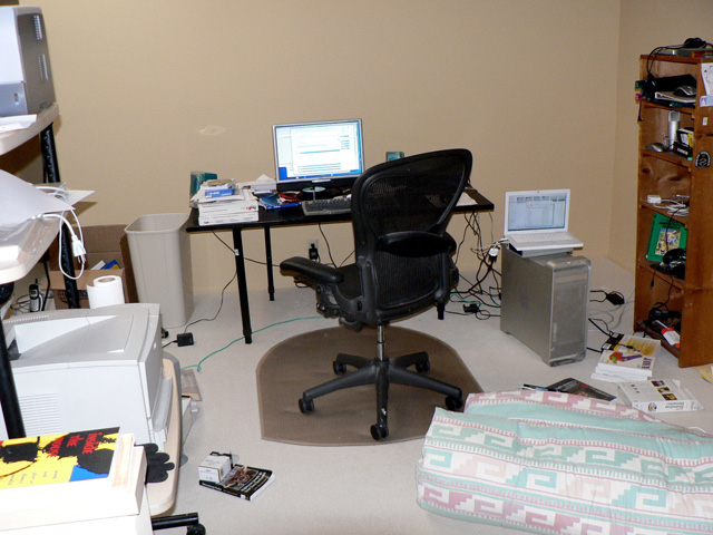 Loft office with shag carpet and Aeron chair, quite messy